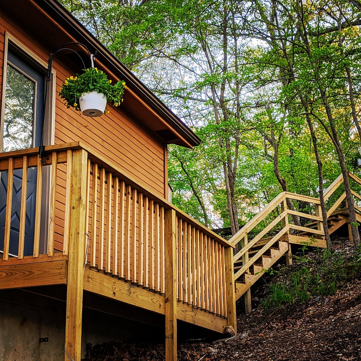 Side door that leads to the 2nd floor and the steps lead to the upper parking lot